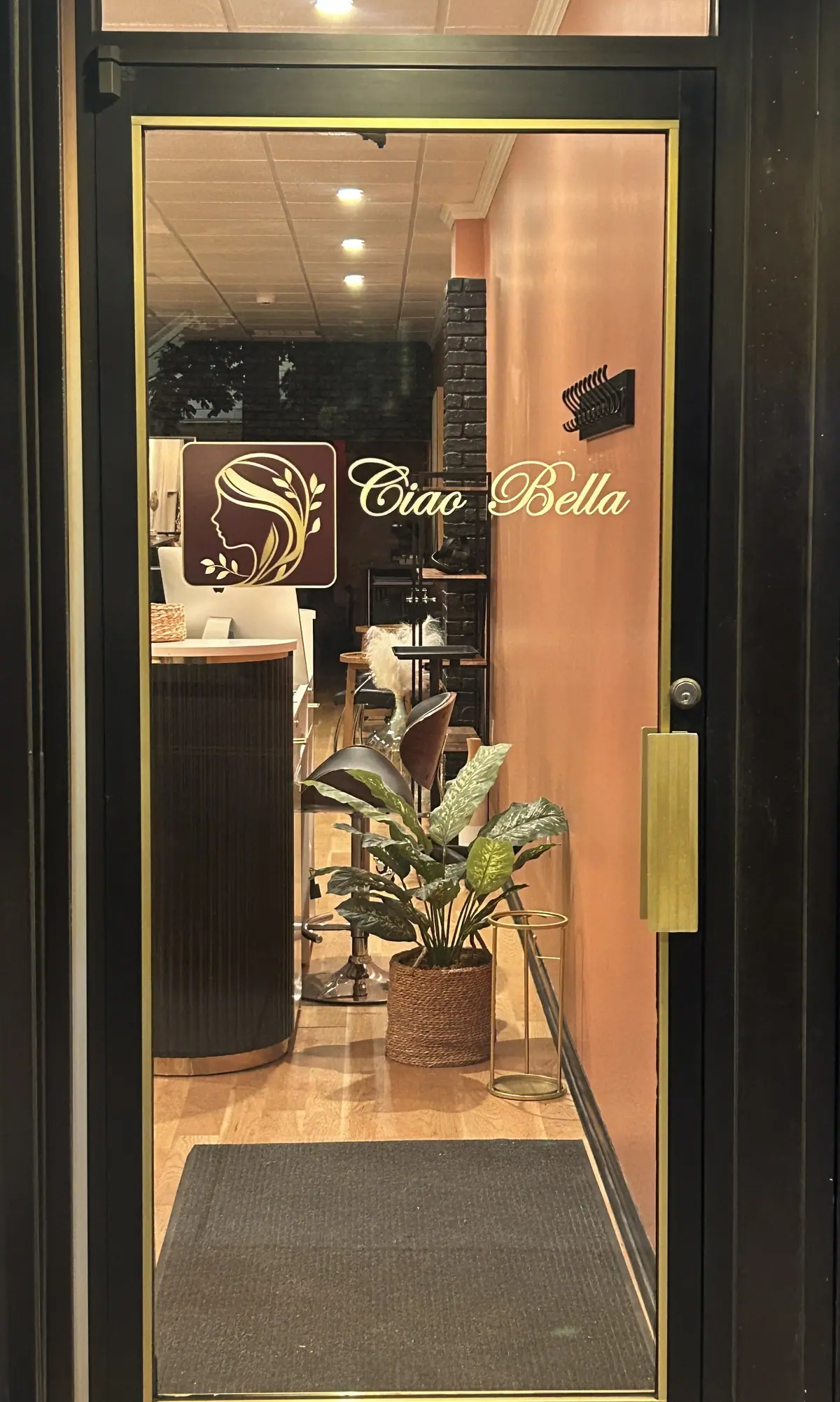 The Ciao Bella Hair Studio storefront door at 128 Broadway, Hillsdale