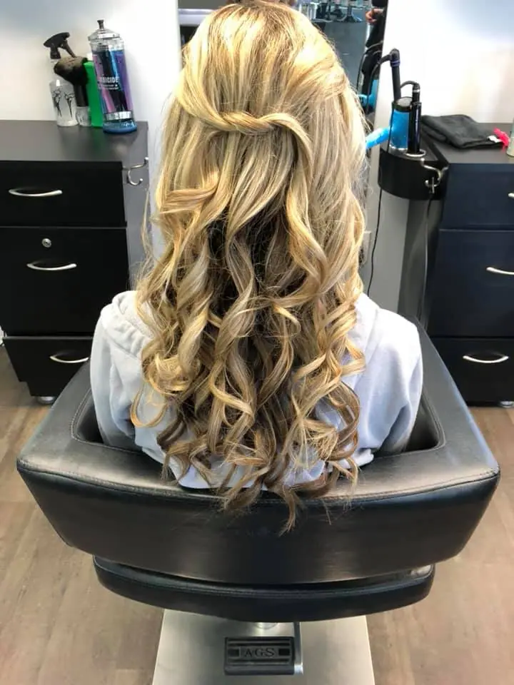 Golden blonde curled half-up style for a special occasion