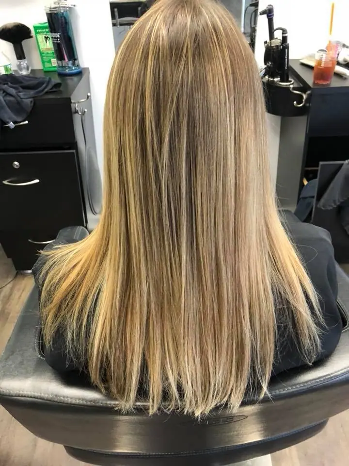 Sleek, straight, blended blonde after color and blowout